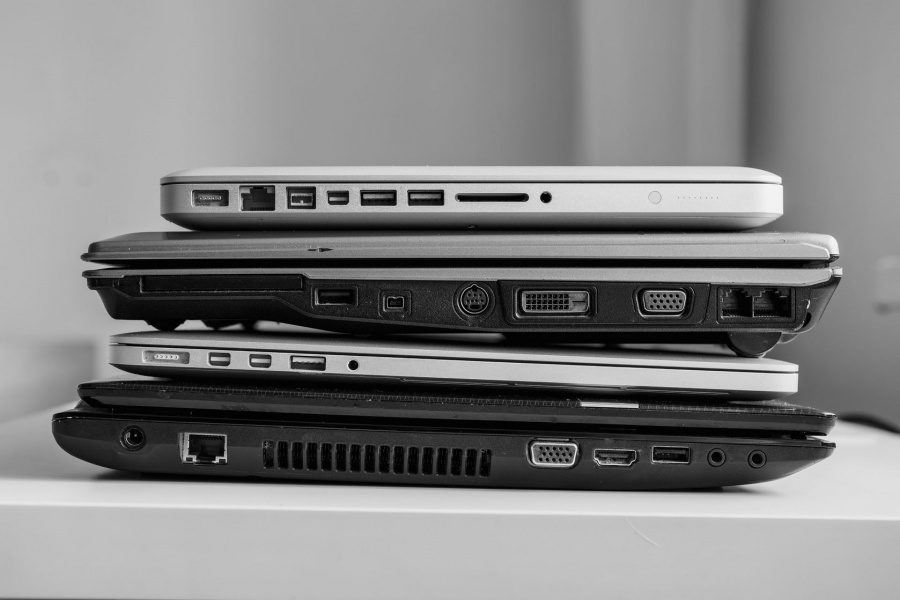 Stack of laptops ready for recycling