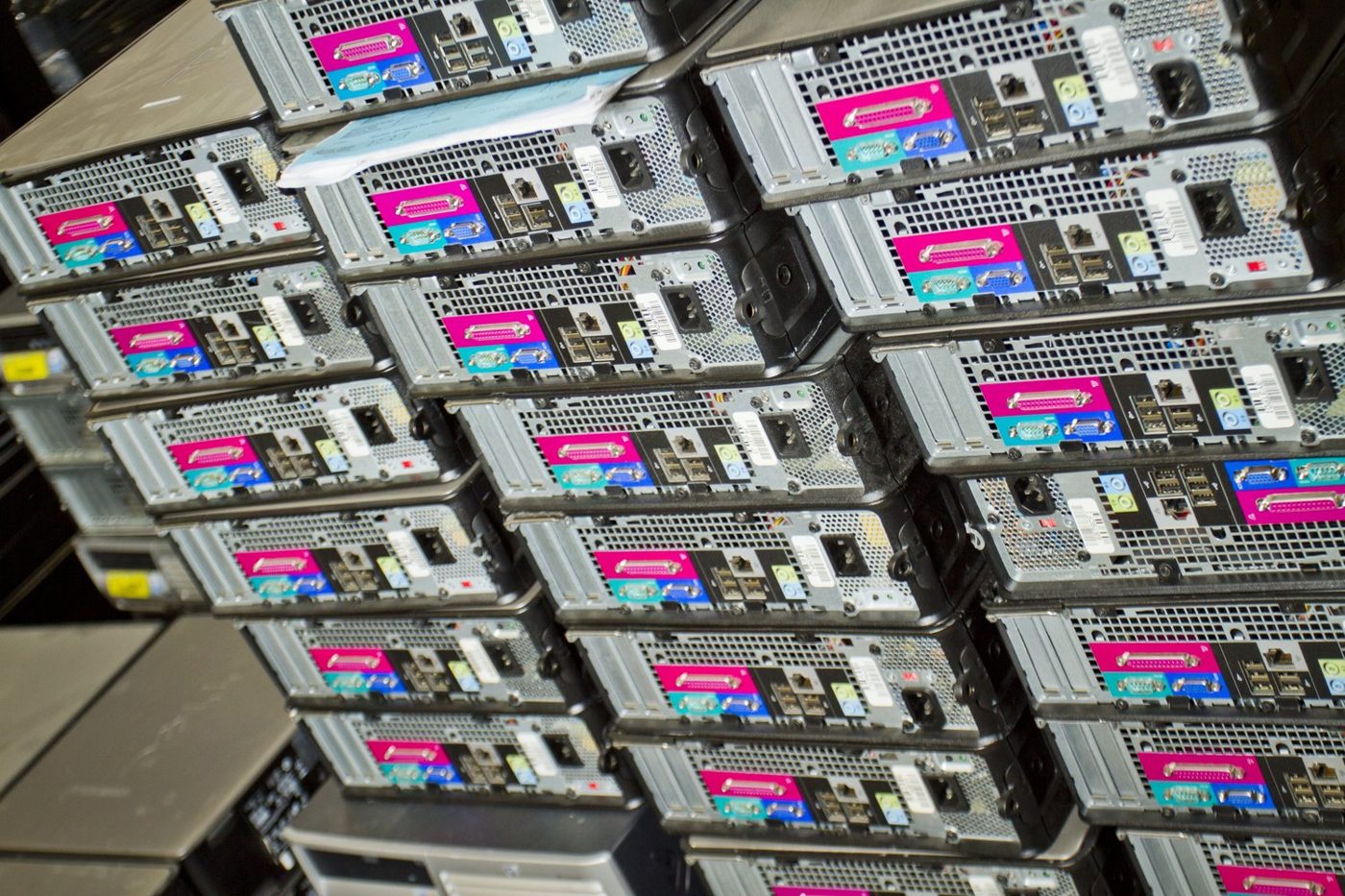 Stack of desktop computers ready for recycling